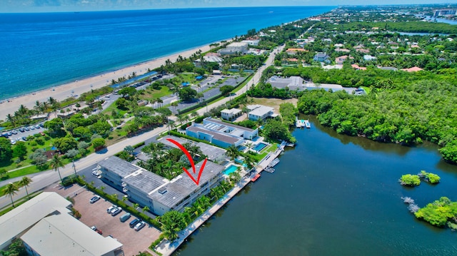 bird's eye view with a water view and a view of the beach