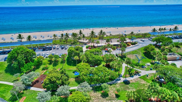 aerial view with a water view and a view of the beach