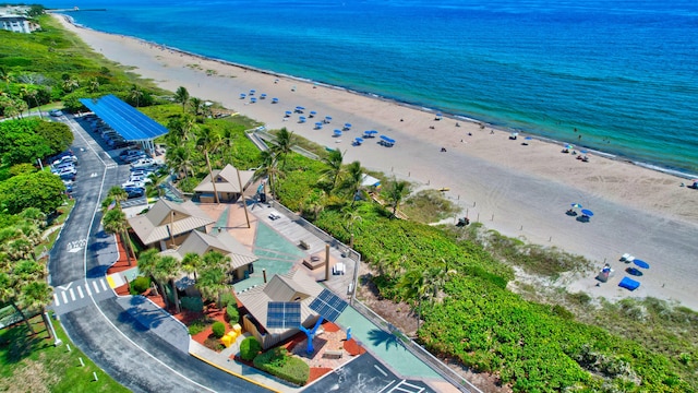 bird's eye view featuring a beach view and a water view