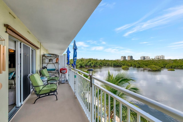 balcony featuring a water view