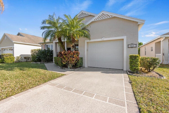 view of front of home with a front lawn and a garage