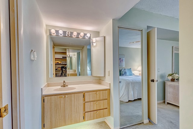 bathroom with a textured ceiling and vanity