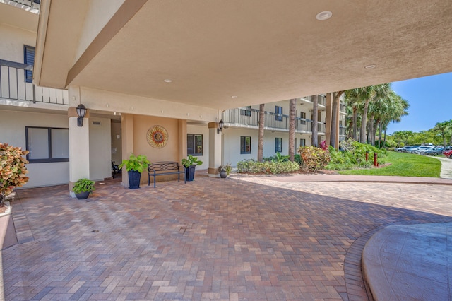 view of patio featuring a balcony