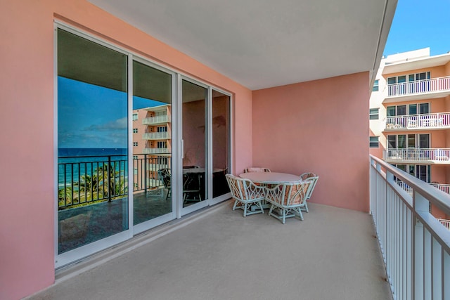 balcony featuring a water view