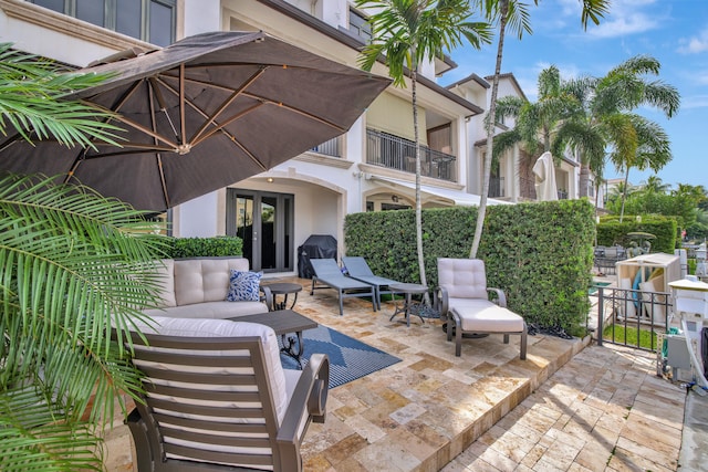 view of patio / terrace featuring a balcony and an outdoor living space