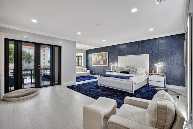 bedroom featuring ornamental molding, hardwood / wood-style floors, french doors, and access to exterior