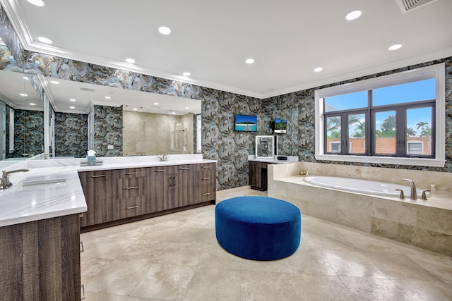 bathroom featuring crown molding, vanity, and separate shower and tub