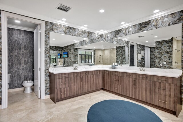 bathroom featuring vanity, ornamental molding, toilet, a bidet, and a shower with door