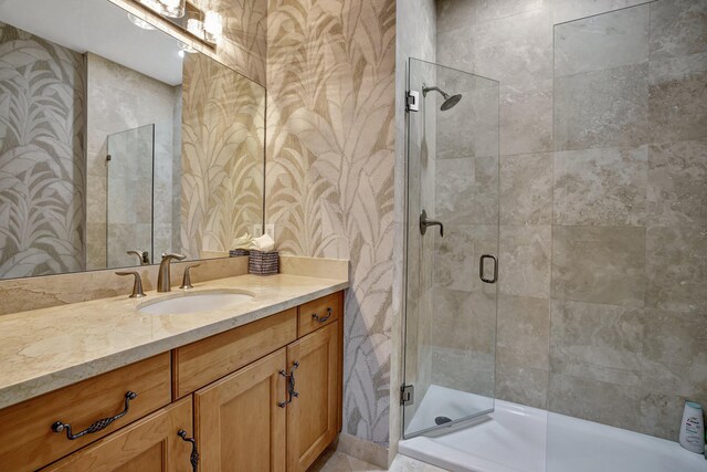 bathroom with vanity and an enclosed shower