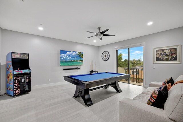 game room with light hardwood / wood-style flooring, ceiling fan, and billiards