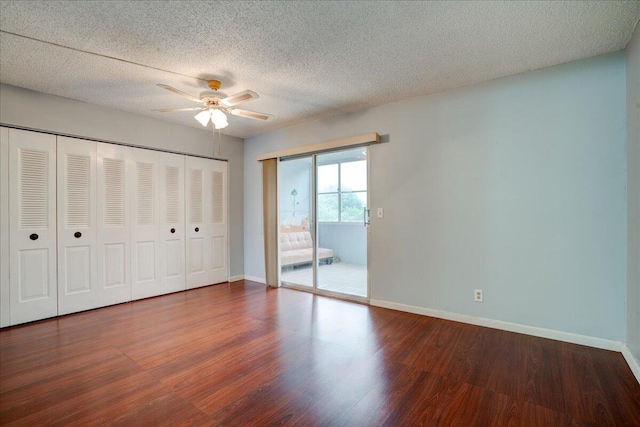 unfurnished bedroom with a textured ceiling, ceiling fan, and wood-type flooring