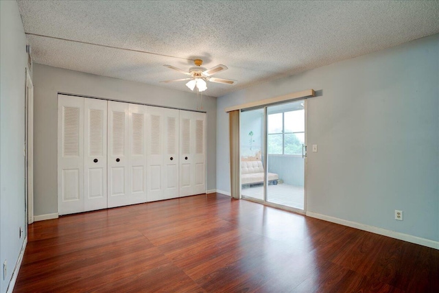 unfurnished bedroom featuring hardwood / wood-style floors, ceiling fan, access to outside, and a textured ceiling