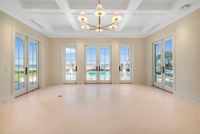 tiled empty room with an inviting chandelier, coffered ceiling, beam ceiling, and french doors