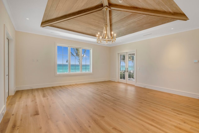 spare room with light wood-type flooring, wooden ceiling, french doors, and beam ceiling