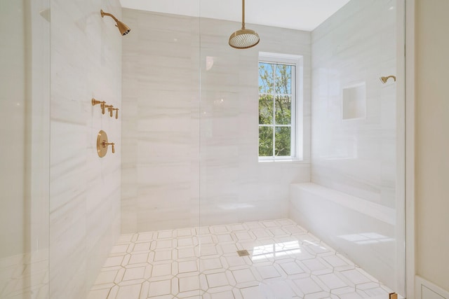 bathroom with tiled shower