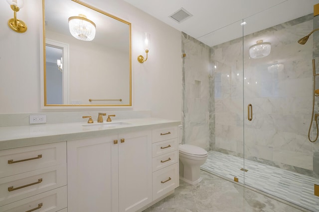 bathroom featuring toilet, tile flooring, a shower with shower door, and vanity