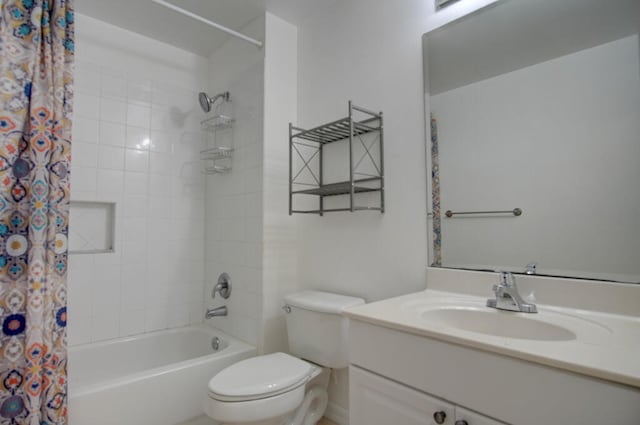 full bathroom with toilet, vanity, and shower / tub combo with curtain