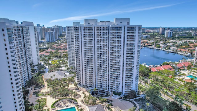 view of property with a water view and a pool