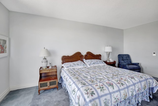 carpeted bedroom with a textured ceiling