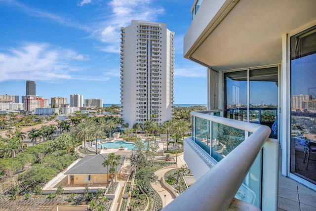 balcony featuring a community pool