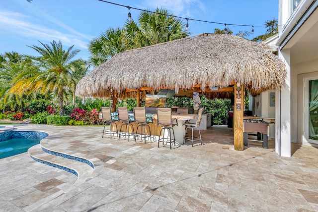 view of patio featuring exterior bar