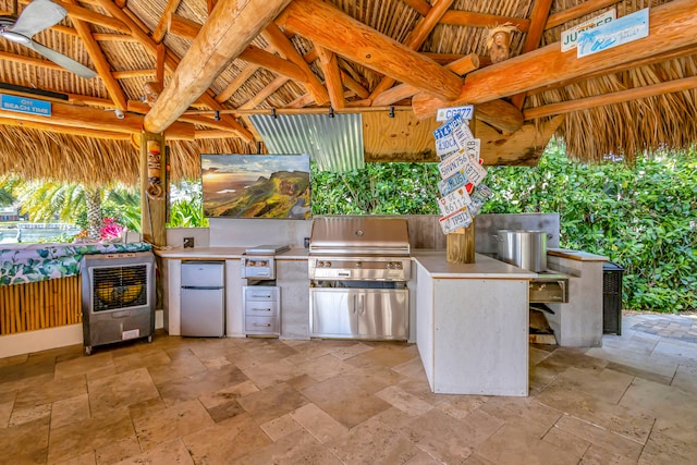 view of patio featuring a grill, area for grilling, and a gazebo