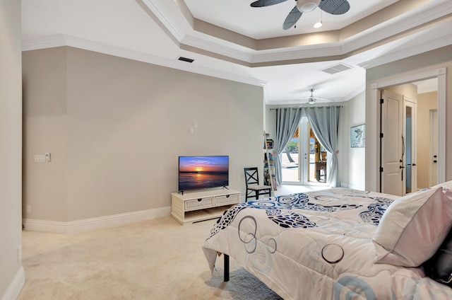 carpeted bedroom featuring access to exterior, ceiling fan, a tray ceiling, and crown molding