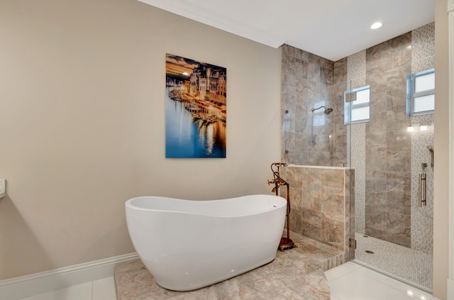 bathroom with tile patterned floors and independent shower and bath