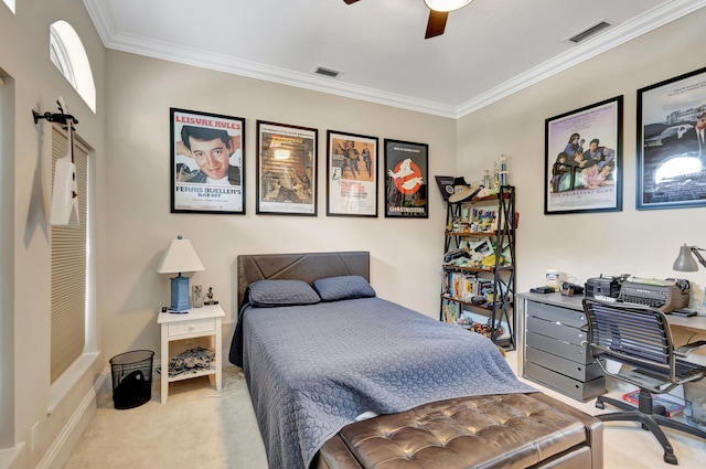 carpeted bedroom featuring ceiling fan and crown molding