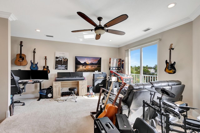 workout area with carpet flooring, ceiling fan, and ornamental molding