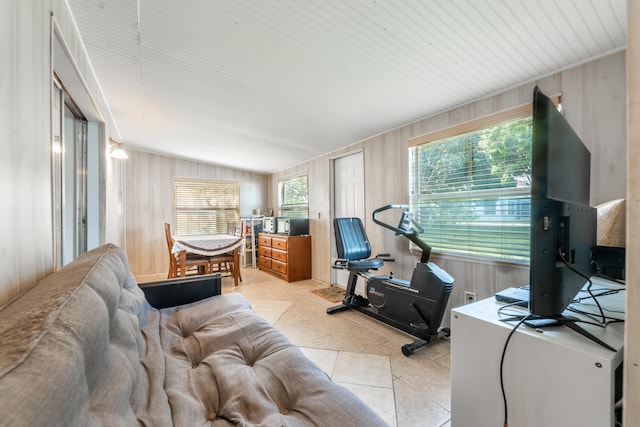 living room with light tile flooring and vaulted ceiling