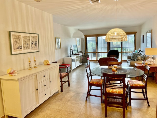 dining space with light tile patterned floors