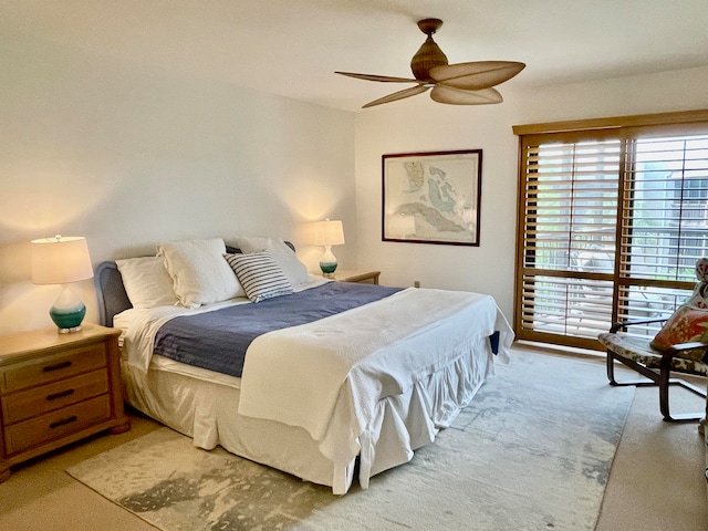 bedroom featuring light carpet and ceiling fan