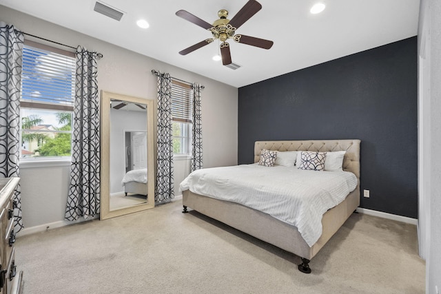 bedroom featuring ceiling fan and light colored carpet