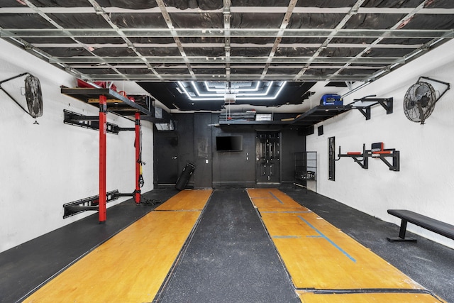 exercise area featuring concrete flooring