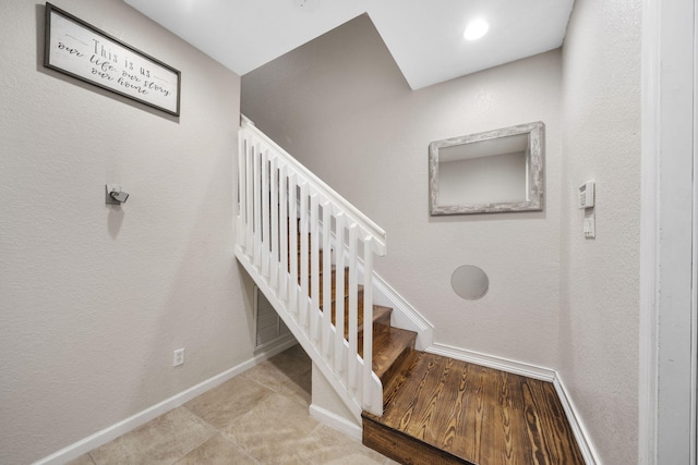 stairs with light tile floors