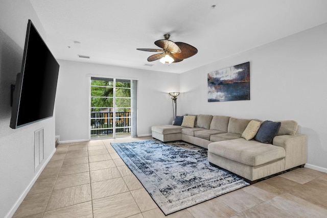 living room featuring ceiling fan and light tile floors