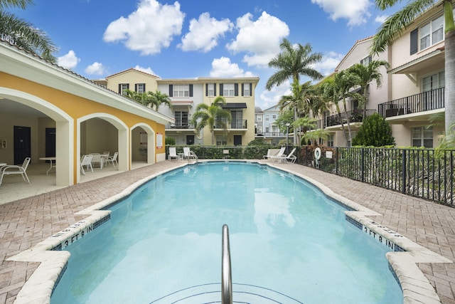 view of swimming pool with a patio area