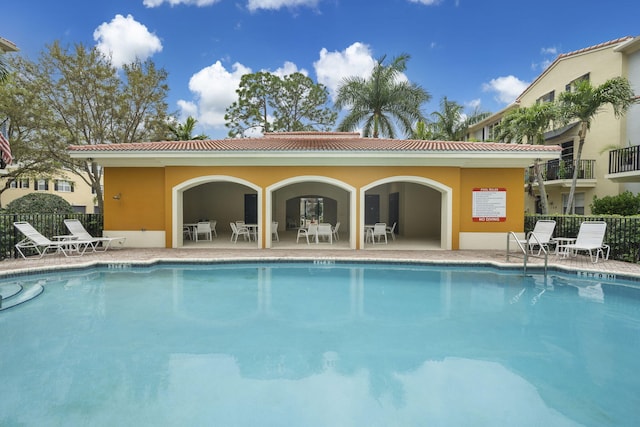 view of swimming pool with a patio area