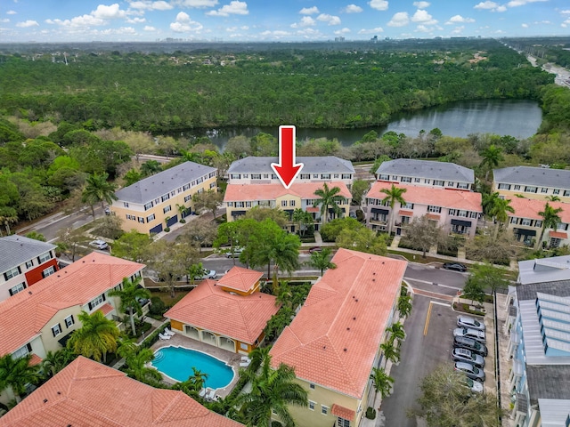 birds eye view of property with a water view