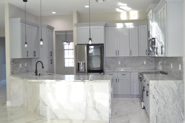 kitchen with light stone countertops, sink, appliances with stainless steel finishes, and tasteful backsplash