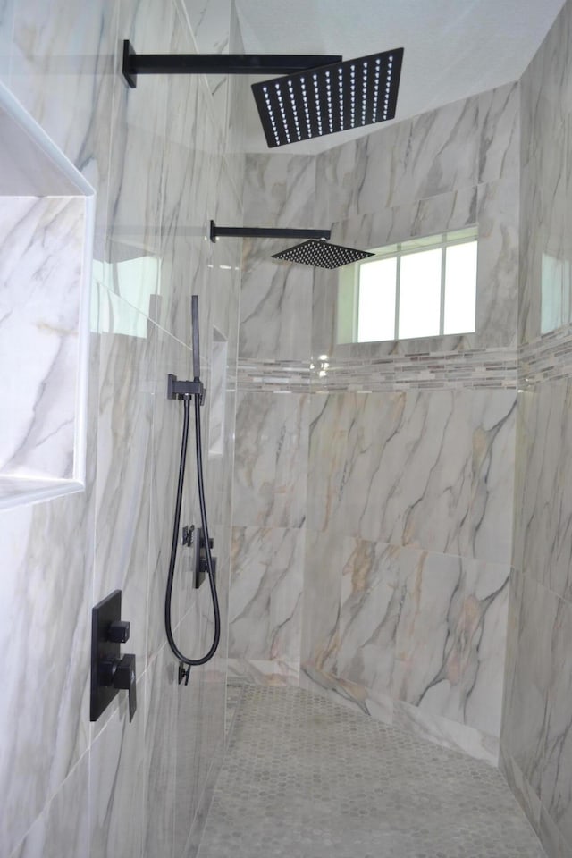 bathroom featuring tiled shower