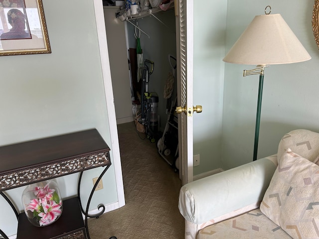 bedroom featuring a closet and dark colored carpet