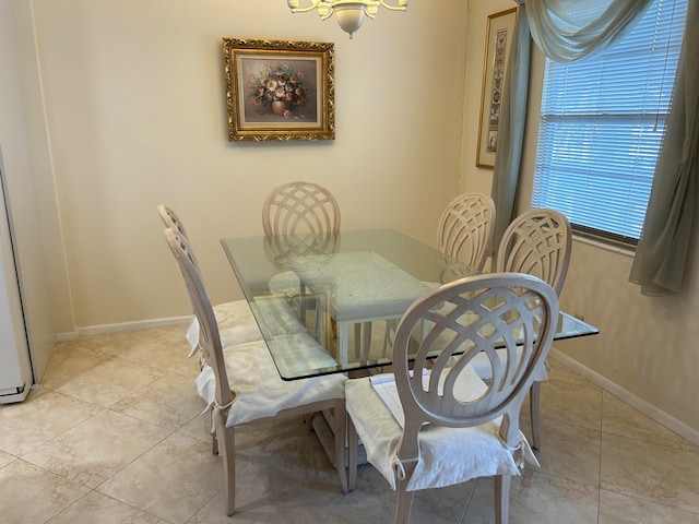 tiled dining room with a wealth of natural light