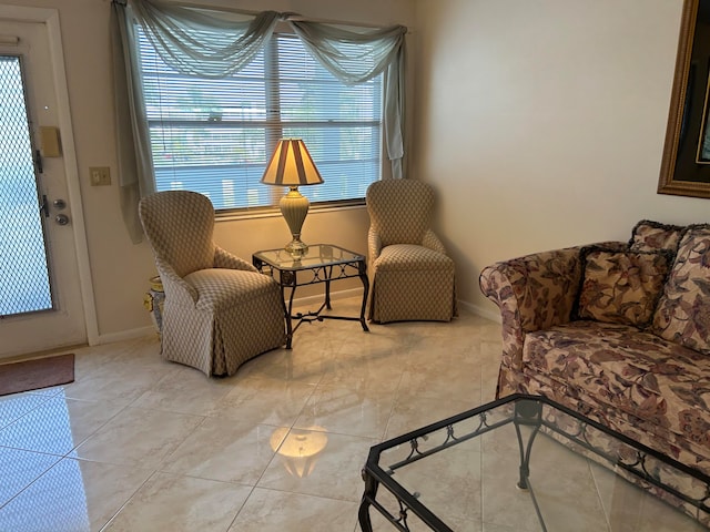 sitting room featuring light tile floors