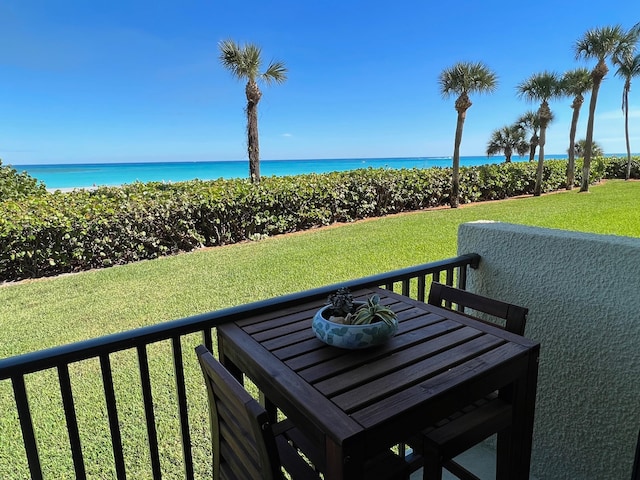 exterior space featuring a water view and a yard