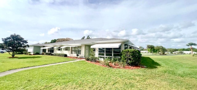 view of front of home with a front yard