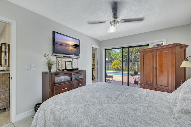 tiled bedroom featuring access to exterior, a textured ceiling, and ceiling fan