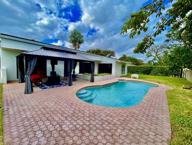 view of pool featuring a gazebo, a patio area, an outdoor hangout area, and a yard