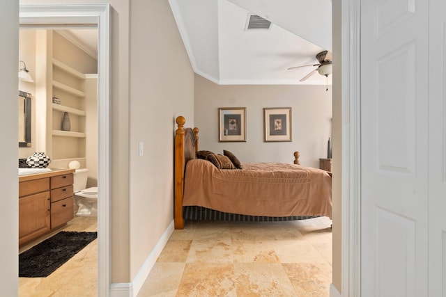 tiled bedroom with ornamental molding and ceiling fan